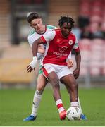 20 October 2024; Sameuel Ogungbe of St Patrick’s Athletic in action against David Nolan of Cork City during the EA SPORTS MU15 LOI Michael Hayes Cup match between Cork City and St Patrick’s Athletic at Turner’s Cross in Cork. Photo by Michael P Ryan/Sportsfile