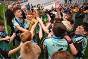 22 October 2024; St. Kilian's SNS players celebrate with the cup after the match between St. Kilian's SNS, Kingswood, Dublin, and Gaelscoil Shliabh Rua, Dublin, on day two of the Allianz Cumann na mBunscol Finals at Croke Park in Dublin. Photo by Ramsey Cardy/Sportsfile