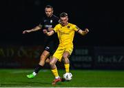 24 October 2024; James Crawford of Wexford in action against Kyle Robinson of Athlone Town during the SSE Airtricity Men's First Division Play-Off semi-final first leg match between Athlone Town and Wexford at Athlone Town Stadium in Westmeath. Photo by Tyler Miller/Sportsfile