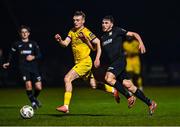 24 October 2024; Brian Torre of Athlone Town in action against James Crawford of Wexford during the SSE Airtricity Men's First Division Play-Off semi-final first leg match between Athlone Town and Wexford at Athlone Town Stadium in Westmeath. Photo by Tyler Miller/Sportsfile