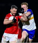 25 October 2024; Matthew Donnelly of Trillick in action against Peter Og McCartan of Errigal Ciaran during the Tyrone County Senior Club Football Championship final match between Errigal Ciarán and Trillick at O'Neills Healy Park in Omagh, Tyrone. Photo by Ramsey Cardy/Sportsfile