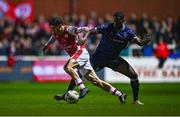 25 October 2024; Kian Leavy of St Patrick's Athletic in action against Sadou Diallo of Derry City during the SSE Airtricity Men's Premier Division match between St Patrick's Athletic and Derry City at Richmond Park in Dublin. Photo by Tyler Miller/Sportsfile