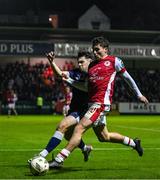 25 October 2024; Kian Leavy of St Patrick's Athletic in action against Adam O'Reilly of Derry City during the SSE Airtricity Men's Premier Division match between St Patrick's Athletic and Derry City at Richmond Park in Dublin. Photo by David Fitzgerald/Sportsfile