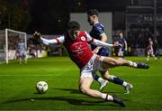 25 October 2024; Kian Leavy of St Patrick's Athletic in action against Adam O'Reilly of Derry City during the SSE Airtricity Men's Premier Division match between St Patrick's Athletic and Derry City at Richmond Park in Dublin. Photo by David Fitzgerald/Sportsfile