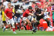 26 October 2024; Siya Kolisi of Hollywoodbets Sharks gets his pass away as Mike Haley of Munster challenges during the United Rugby Championship match between Hollywoodbets Sharks and Munster at Hollywoodbets Kings Park in Durban, South Africa. Photo by Shaun Roy/Sportsfile