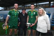 26 October 2024; Brothers Tom and Dan Morrissey with their dad Donal and Susan Fitzpatrick after the Shinty International match between Ireland and Scotland at Cusack Park in Ennis, Clare. Photo by Ray McManus/Sportsfile