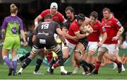 26 October 2024; Mike Haley of Munster is tackled by Hollywoodbets Sharks captain Eben Etzebeth during the United Rugby Championship match between Hollywoodbets Sharks and Munster at Hollywoodbets Kings Park in Durban, South Africa. Photo by Shaun Roy/Sportsfile