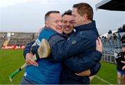 26 October 2024; Ireland manager Michael Kavanagh, Kevin O'Brien and Damien Coleman, right, celebrate after the Shinty International match between Ireland and Scotland at Cusack Park in Ennis, Clare. Photo by Ray McManus/Sportsfile