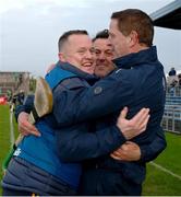 26 October 2024; Ireland manager Michael Kavanagh, Kevin O'Brien and Damien Coleman, right, celebrate after the Shinty International match between Ireland and Scotland at Cusack Park in Ennis, Clare. Photo by Ray McManus/Sportsfile
