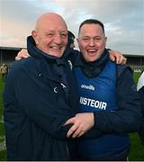 26 October 2024; Terence McNaughton, left, and Ireland manager Michael Kavanagh celebrate after the Shinty International match between Ireland and Scotland at Cusack Park in Ennis, Clare. Photo by Ray McManus/Sportsfile