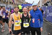 27 October 2024; Ger Copeland of Dublin Bay Running AC, centre, Matthew Collins of Portmarnock AC, left, and race director Jim Aughney after finishing the 2024 Irish Life Dublin Marathon. This marks the 43rd edition of the race with thousands of participants from international athletes, club runners, wheelchair-assisted participants, charity runners, and first-time marathon participants taking on the 26.2-mile challenge. This year’s race started on Leeson Street and finished at the Pepper Canister Church on Mount Street Upper. Photo by Sam Barnes/Sportsfile
