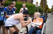 27 October 2024; Actor Colin Farrell with Emma Fogarty during the 2024 Irish Life Dublin Marathon. This marks the 43rd edition of the race with thousands of participants from international athletes, club runners, wheelchair-assisted participants, charity runners, and first-time marathon participants taking on the 26.2-mile challenge. This year’s race started on Leeson Street and finished at the Pepper Canister Church on Mount Street Upper. Photo by Ramsey Cardy/Sportsfile