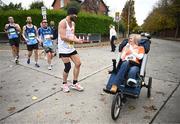 27 October 2024; Actor Colin Farrell with Emma Fogarty during the 2024 Irish Life Dublin Marathon. This marks the 43rd edition of the race with thousands of participants from international athletes, club runners, wheelchair-assisted participants, charity runners, and first-time marathon participants taking on the 26.2-mile challenge. This year’s race started on Leeson Street and finished at the Pepper Canister Church on Mount Street Upper. Photo by Ramsey Cardy/Sportsfile