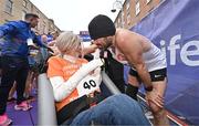 27 October 2024; Actor Colin Farrell with Emma Fogarty after finishing the 2024 Irish Life Dublin Marathon. This marks the 43rd edition of the race with thousands of participants from international athletes, club runners, wheelchair-assisted participants, charity runners, and first-time marathon participants taking on the 26.2-mile challenge. This year’s race started on Leeson Street and finished at the Pepper Canister Church on Mount Street Upper. Photo by Sam Barnes/Sportsfile