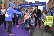 27 October 2024; Actor Colin Farrell with Emma Fogarty after finishing the 2024 Irish Life Dublin Marathon. This marks the 43rd edition of the race with thousands of participants from international athletes, club runners, wheelchair-assisted participants, charity runners, and first-time marathon participants taking on the 26.2-mile challenge. This year’s race started on Leeson Street and finished at the Pepper Canister Church on Mount Street Upper. Photo by Sam Barnes/Sportsfile