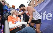 27 October 2024; Actor Colin Farrell with Emma Fogarty after finishing the 2024 Irish Life Dublin Marathon. This marks the 43rd edition of the race with thousands of participants from international athletes, club runners, wheelchair-assisted participants, charity runners, and first-time marathon participants taking on the 26.2-mile challenge. This year’s race started on Leeson Street and finished at the Pepper Canister Church on Mount Street Upper. Photo by Sam Barnes/Sportsfile