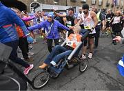 27 October 2024; Actor Colin Farrell with Emma Fogarty after finishing the 2024 Irish Life Dublin Marathon. This marks the 43rd edition of the race with thousands of participants from international athletes, club runners, wheelchair-assisted participants, charity runners, and first-time marathon participants taking on the 26.2-mile challenge. This year’s race started on Leeson Street and finished at the Pepper Canister Church on Mount Street Upper. Photo by Sam Barnes/Sportsfile