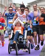 27 October 2024; Actor Colin Farrell with Emma Fogerty celebrate on their way to finishing the 2024 Irish Life Dublin Marathon. This marks the 43rd edition of the race with thousands of participants from international athletes, club runners, wheelchair-assisted participants, charity runners, and first-time marathon participants taking on the 26.2-mile challenge. This year’s race started on Leeson Street and finished at the Pepper Canister Church on Mount Street Upper. Photo by Sam Barnes/Sportsfile