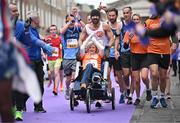 27 October 2024; Actor Colin Farrell with Emma Fogerty celebrate on their way to finishing the 2024 Irish Life Dublin Marathon. This marks the 43rd edition of the race with thousands of participants from international athletes, club runners, wheelchair-assisted participants, charity runners, and first-time marathon participants taking on the 26.2-mile challenge. This year’s race started on Leeson Street and finished at the Pepper Canister Church on Mount Street Upper. Photo by Sam Barnes/Sportsfile