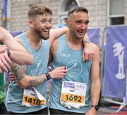 27 October 2024; Craig Dunne, left, and Philip Mc Donagh celebrate after finishing the 2024 Irish Life Dublin Marathon. This marks the 43rd edition of the race with thousands of participants from international athletes, club runners, wheelchair-assisted participants, charity runners, and first-time marathon participants taking on the 26.2-mile challenge. This year’s race started on Leeson Street and finished at the Pepper Canister Church on Mount Street Upper. Photo by Sam Barnes/Sportsfile