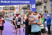 27 October 2024; Craig Dunne, left, and Philip Mc Donagh celebrate after finishing the 2024 Irish Life Dublin Marathon. This marks the 43rd edition of the race with thousands of participants from international athletes, club runners, wheelchair-assisted participants, charity runners, and first-time marathon participants taking on the 26.2-mile challenge. This year’s race started on Leeson Street and finished at the Pepper Canister Church on Mount Street Upper. Photo by Sam Barnes/Sportsfile