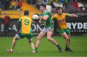 27 October 2024; Gerard Davoren of Moycullen in action against Michael Farragher and Kieran Molloy of Corofin during the Galway County Senior Club Football Championship final match between Moycullen and Corofin at Tuam Stadium in Galway. Photo by Ray Ryan/Sportsfile