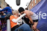 27 October 2024; Actor Colin Farrell with Emma Fogarty after finishing the 2024 Irish Life Dublin Marathon. This marks the 43rd edition of the race with thousands of participants from international athletes, club runners, wheelchair-assisted participants, charity runners, and first-time marathon participants taking on the 26.2-mile challenge. This year’s race started on Leeson Street and finished at the Pepper Canister Church on Mount Street Upper. Photo by Sam Barnes/Sportsfile