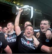 27 October 2024; Brian Hurley, 9, of Newcastle West celebrates with the cup after the Limerick County Premier Intermediate Hurling Championship final match between Garryspillane and Newcastle West at TUS Gaelic Grounds in Limerick. Photo by Ray McManus/Sportsfile