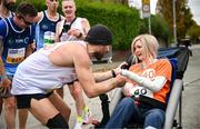 27 October 2024; Actor Colin Farrell with Emma Fogarty during the 2024 Irish Life Dublin Marathon. This marks the 43rd edition of the race with thousands of participants from international athletes, club runners, wheelchair-assisted participants, charity runners, and first-time marathon participants taking on the 26.2-mile challenge. This year’s race started on Leeson Street and finished at the Pepper Canister Church on Mount Street Upper. Photo by Ramsey Cardy/Sportsfile