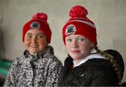 27 October 2024; Ava Horan and Mary Kate English, both 11 years, from Oola, during the Limerick County Senior Club Hurling Championship final match between Na Piarsaigh and Doon at TUS Gaelic Grounds in Limerick. Photo by Ray McManus/Sportsfile