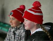 27 October 2024; Ava Horan and Mary Kate English, both 11 years, from Oola, during the Limerick County Senior Club Hurling Championship final match between Na Piarsaigh and Doon at TUS Gaelic Grounds in Limerick. Photo by Ray McManus/Sportsfile