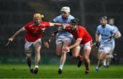 27 October 2024; JJ Carey of Na Piarsaigh is tackled by Richie English and Darragh O'Donovan of Doon during the Limerick County Senior Club Hurling Championship final match between Na Piarsaigh and Doon at TUS Gaelic Grounds in Limerick. Photo by Ray McManus/Sportsfile