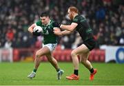 27 October 2024; Conor Doherty of Newbridge in action against Conor Glass of Glen during the Derry County Senior Club Football Championship final match between Glen and Newbridge at Celtic Park in Derry. Photo by Oliver McVeigh/Sportsfile