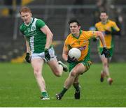 27 October 2024; Kieran Molloy of Corofin in action against Peter Cooke of Moycullen during the Galway County Senior Club Football Championship final match between Moycullen and Corofin at Tuam Stadium in Galway. Photo by Ray Ryan/Sportsfile