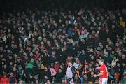 27 October 2024; Supporters watch as Darragh O'Donovan of Doon prepares to take a free during the Limerick County Senior Club Hurling Championship final match between Na Piarsaigh and Doon at TUS Gaelic Grounds in Limerick. Photo by Ray McManus/Sportsfile
