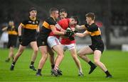 27 October 2024; Brian O'Connor of Dingle is tackled by Evan Looney, left, and Cian McMahon of Dr Crokes during the Kerry County Senior Club Football Championship final match between Dingle and Dr Crokes at Austin Stack Park in Tralee, Kerry. Photo by Brendan Moran/Sportsfile