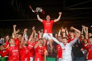 27 October 2024; Darragh O'Donovan of Doon lifts the John Daly Cup and celebrates with teammates after the Limerick County Senior Club Hurling Championship final match between Na Piarsaigh and Doon at TUS Gaelic Grounds in Limerick. Photo by Ray McManus/Sportsfile
