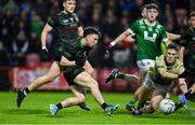27 October 2024; Conleith McGuckian of Glen scoring his sides first goal against James Gribbin of Newbridge in the second half  during the Derry County Senior Club Football Championship final match between Glen and Newbridge at Celtic Park in Derry. Photo by Oliver McVeigh/Sportsfile