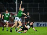 27 October 2024; Conleith McGuckian of Glen in action against Callum McGrogan of Newbridge during the Derry County Senior Club Football Championship final match between Glen and Newbridge at Celtic Park in Derry. Photo by Oliver McVeigh/Sportsfile