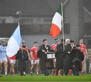 27 October 2024; Both teams parade behind the Tricolour carried by a member of the CBS Pipe Band before the Limerick County Senior Club Hurling Championship final match between Na Piarsaigh and Doon at TUS Gaelic Grounds in Limerick. Photo by Ray McManus/Sportsfile