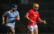 27 October 2024; Adam English of Doon, with Jerome Boylan of Na Piarsaigh in persuit, on his way to score his side's 12th point, in the 41st minute, during the Limerick County Senior Club Hurling Championship final match between Na Piarsaigh and Doon at TUS Gaelic Grounds in Limerick. Photo by Ray McManus/Sportsfile