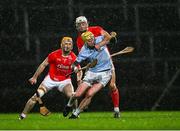27 October 2024; JJ Carey of Na Piarsaigh is tackled by Pat Ryan and Richie English, 7, of Doon during the Limerick County Senior Club Hurling Championship final match between Na Piarsaigh and Doon at TUS Gaelic Grounds in Limerick. Photo by Ray McManus/Sportsfile