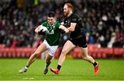27 October 2024; Conor Doherty of Newbridge  in action against Conor Glass of Glen during the Derry County Senior Club Football Championship final match between Glen and Newbridge at Celtic Park in Derry. Photo by Oliver McVeigh/Sportsfile