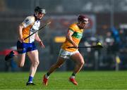 28 October 2024; Shane McGrath of Feakle races clear of Jamie Shanahan of Sixmilebridge during the Clare County Senior Club Hurling Championship final match between Sixmilebridge and Feakle at Cusack Park in Clare. Photo by Ray McManus/Sportsfile