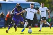 28 October 2024; Thomas Oluwa of Wexford in action against Dylan Hand of Athlone Town during the SSE Airtricity Men's First Division Play-Off semi-final second leg match between Wexford and Athlone Town at Ferrycarrig Park in Wexford. Photo by Shauna Clinton/Sportsfile