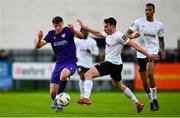 28 October 2024; Mark Hanratty of Wexford is tackled by Brian Torre of Athlone Town during the SSE Airtricity Men's First Division Play-Off semi-final second leg match between Wexford and Athlone Town at Ferrycarrig Park in Wexford. Photo by Shauna Clinton/Sportsfile
