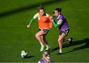 28 October 2024; Heather Payne and Eva Mangan, right, during a Republic of Ireland women's training session at Tallaght Stadium in Dublin. Photo by Stephen McCarthy/Sportsfile