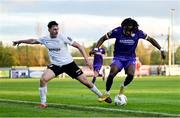 28 October 2024; Thomas Oluwa of Wexford in action against Brian Torre of Athlone Town during the SSE Airtricity Men's First Division Play-Off semi-final second leg match between Wexford and Athlone Town at Ferrycarrig Park in Wexford. Photo by Shauna Clinton/Sportsfile