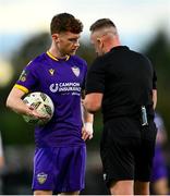 28 October 2024; Mikie Rowe of Wexford remonstrates with referee Alan Patchell during the SSE Airtricity Men's First Division Play-Off semi-final second leg match between Wexford and Athlone Town at Ferrycarrig Park in Wexford. Photo by Shauna Clinton/Sportsfile