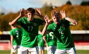 29 October 2024; Brody Lee of Republic of Ireland celebrates with teammate Ramon Martos, left, after scoring their side's first goal during the UEFA U17 European Championships Round 1 Qualifier match between Republic of Ireland and Lithuania at Inver Park in Larne, Antrim. Photo by Ramsey Cardy/Sportsfile